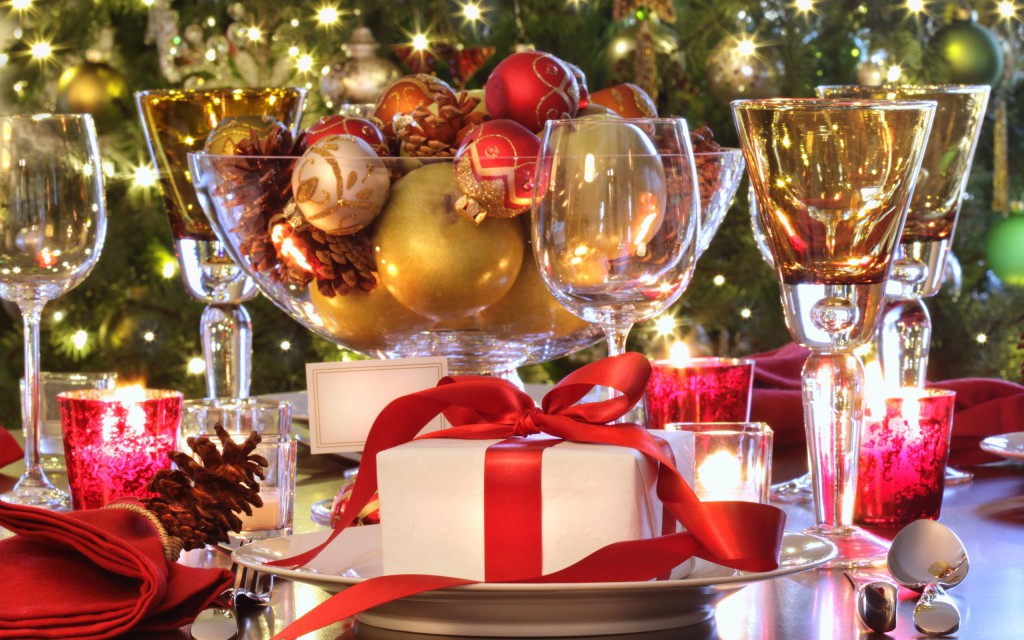 Elegant holiday table setting with red ribboned gift